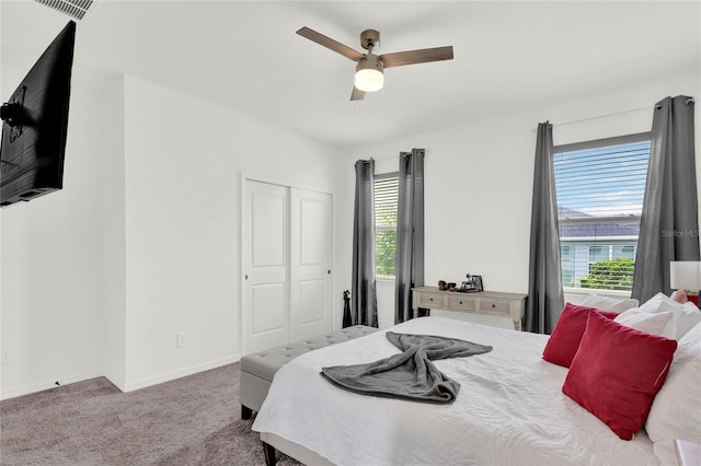 bedroom with carpet flooring, a closet, and ceiling fan