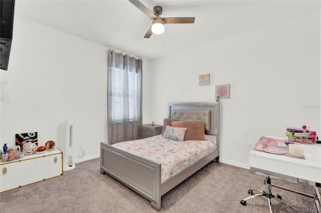 bedroom with ceiling fan and light carpet