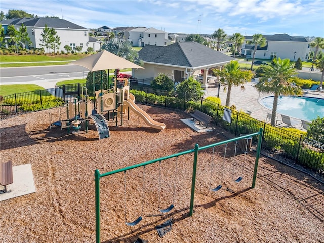 view of jungle gym featuring a fenced in pool