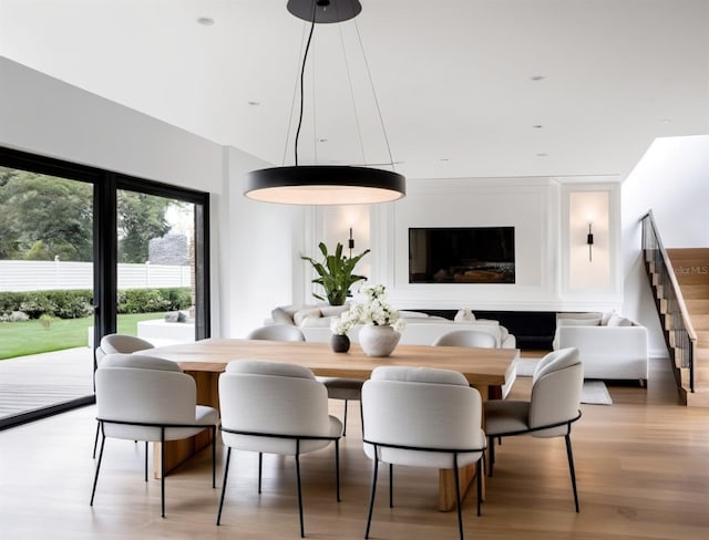 dining area with light hardwood / wood-style floors