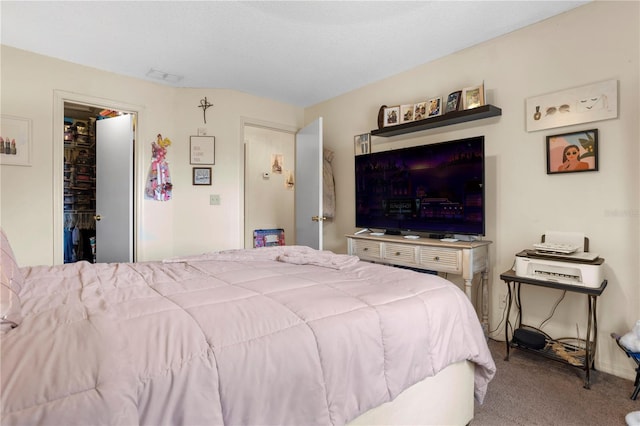 bedroom featuring a closet and light carpet