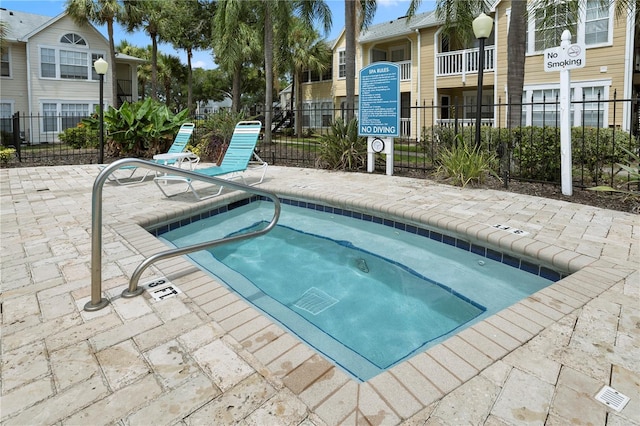 view of pool featuring a community hot tub