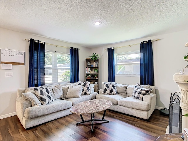 living room featuring hardwood / wood-style floors and a textured ceiling