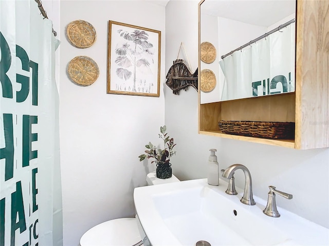 bathroom with sink and toilet