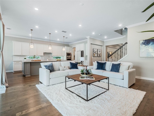 living room with crown molding and dark hardwood / wood-style flooring