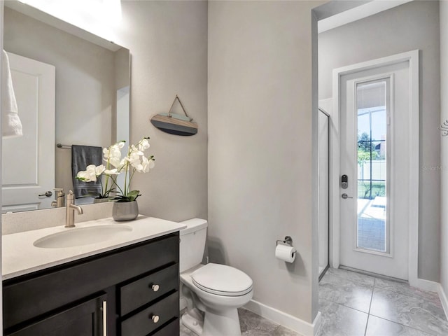 bathroom with vanity and toilet