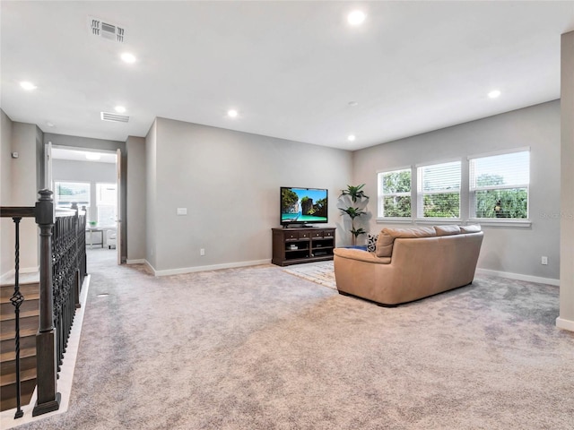 carpeted living room featuring a wealth of natural light