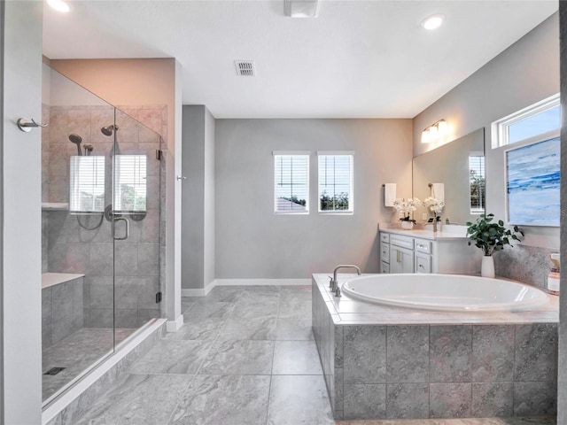 bathroom featuring vanity and separate shower and tub