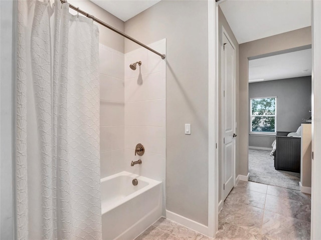 bathroom with shower / tub combo with curtain