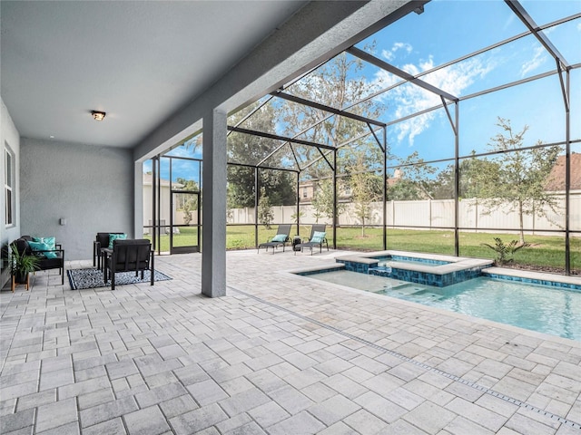 view of swimming pool with an in ground hot tub, a lanai, and a patio area