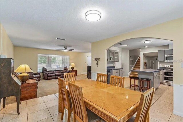 dining room featuring ceiling fan and light tile patterned floors