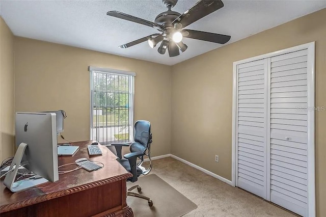 office with light carpet, a textured ceiling, and ceiling fan