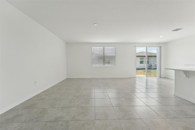 3824 Giorgio Dr, Winter Haven, FL 33884 - empty room featuring light tile patterned floors and baseboards