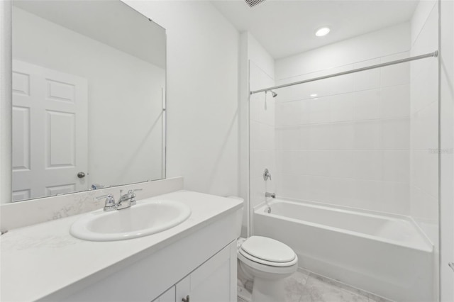 3824 Giorgio Dr, Winter Haven, FL 33884 - full bathroom with vanity, toilet,  shower combination, marble look tiles, and recessed lighting