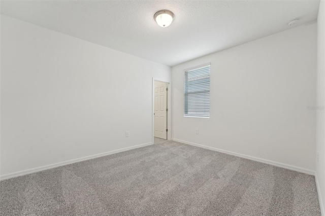 3824 Giorgio Dr, Winter Haven, FL 33884 - carpeted empty room featuring baseboards and a smoke detector