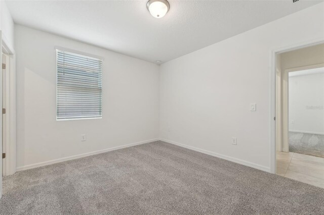 3824 Giorgio Dr, Winter Haven, FL 33884 - unfurnished room with light carpet and baseboards