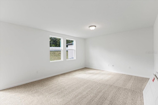 spare room featuring carpet flooring