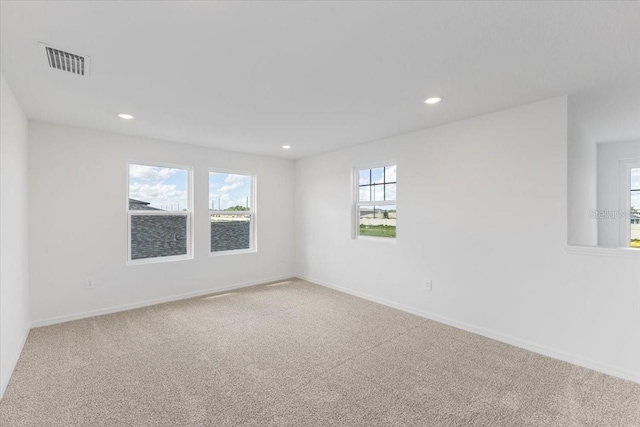 unfurnished room with carpet floors