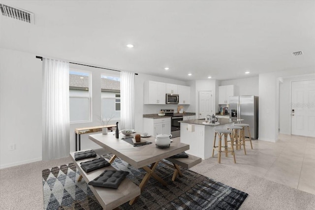 dining room with light tile patterned floors