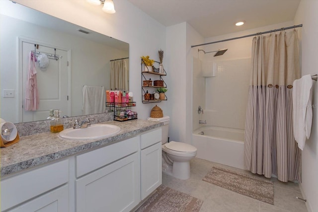 full bathroom with tile patterned flooring, vanity, shower / tub combo, and toilet