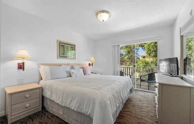 carpeted bedroom featuring access to exterior