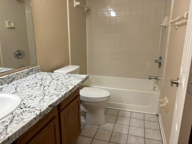 full bathroom featuring toilet, tiled shower / bath, tile patterned flooring, and vanity