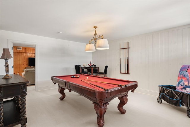 playroom with pool table and wooden walls