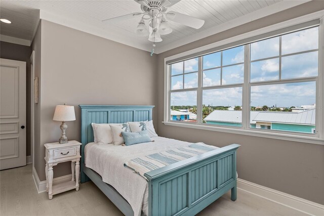 bedroom with light wood-type flooring and ceiling fan