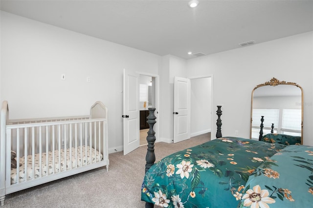 bedroom featuring light colored carpet