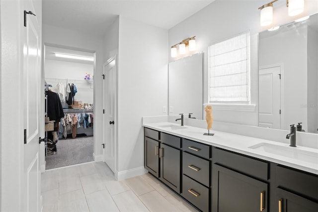 bathroom with tile patterned floors and double vanity