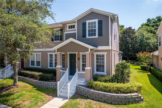 view of front of property with a front lawn and a porch