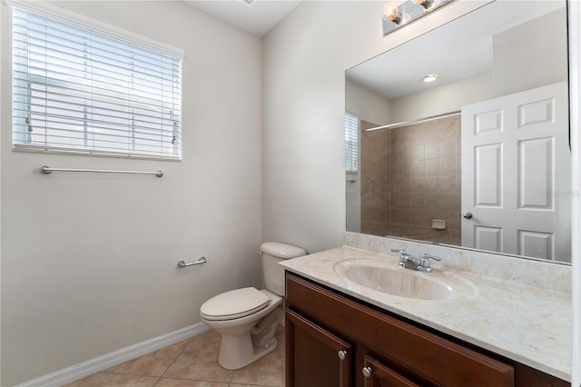 bathroom with tile patterned floors, vanity, toilet, and plenty of natural light