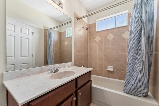 bathroom with shower / tub combo with curtain and vanity