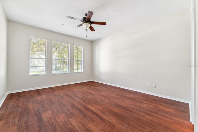 empty room featuring ceiling fan and hardwood / wood-style flooring