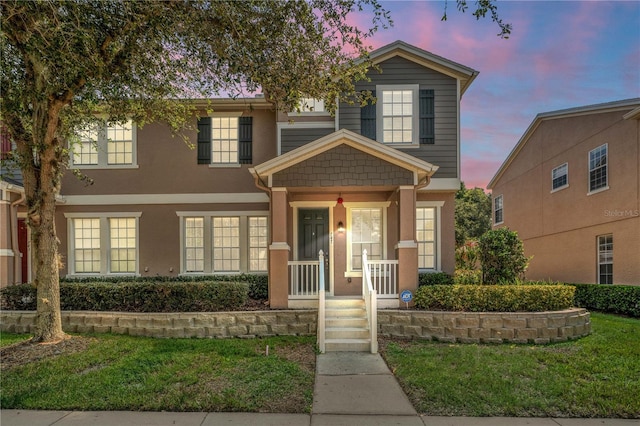 view of front of home featuring a lawn