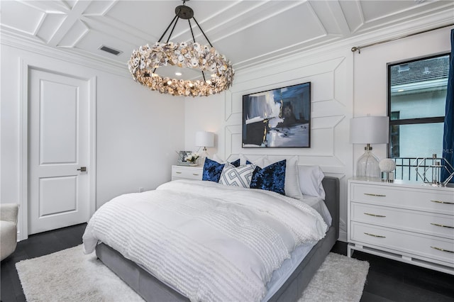 bedroom featuring coffered ceiling, dark hardwood / wood-style floors, and a chandelier