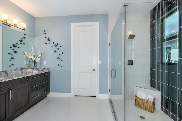 bathroom featuring vanity, a shower with door, and tile patterned flooring