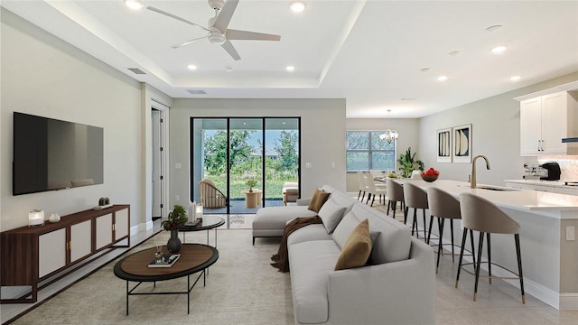 4990 Fairhope Cir, Lakewood Ranch, FL 34211 - living room featuring ceiling fan, recessed lighting, a chandelier, baseboards, and light tile patterned floors