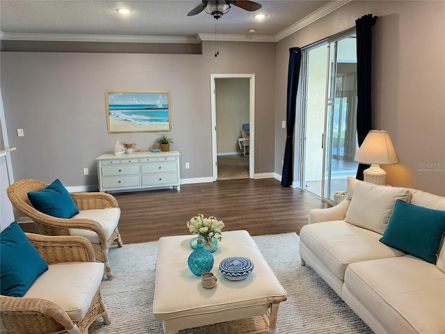 living room featuring dark hardwood / wood-style flooring, ceiling fan, and ornamental molding