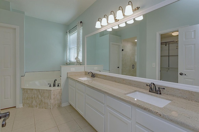 bathroom with tile patterned flooring, vanity, and plus walk in shower