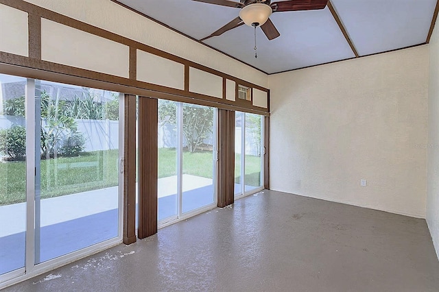 unfurnished room featuring ceiling fan and concrete floors