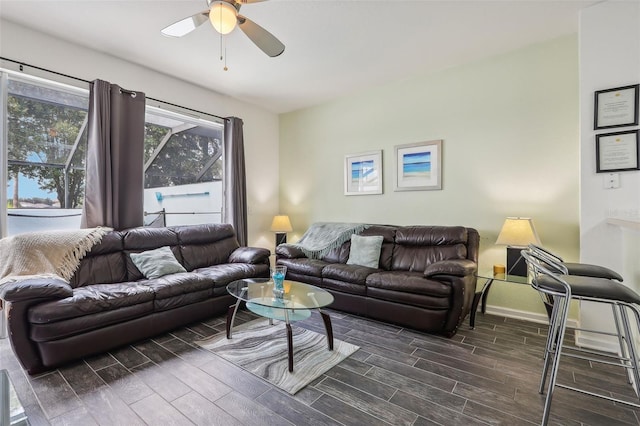 living room featuring ceiling fan and dark hardwood / wood-style flooring