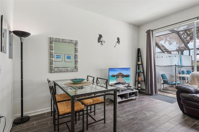 dining area featuring dark wood-type flooring