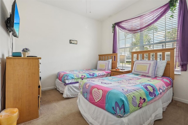 bedroom with light carpet