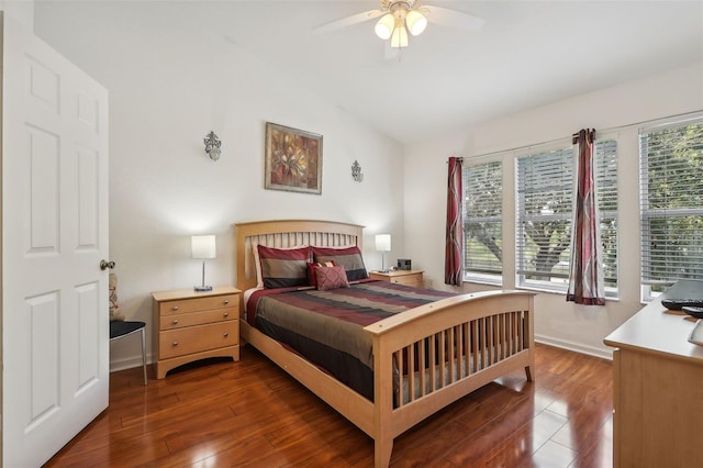 bedroom with ceiling fan, dark hardwood / wood-style floors, and lofted ceiling