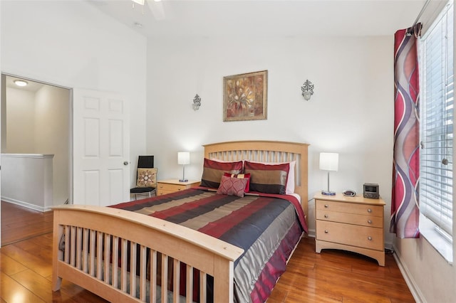 bedroom with ceiling fan and wood-type flooring