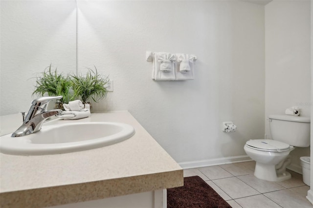 bathroom featuring vanity, toilet, and tile patterned flooring