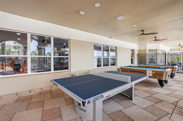 rec room with ceiling fan, billiards, plenty of natural light, and light tile patterned floors