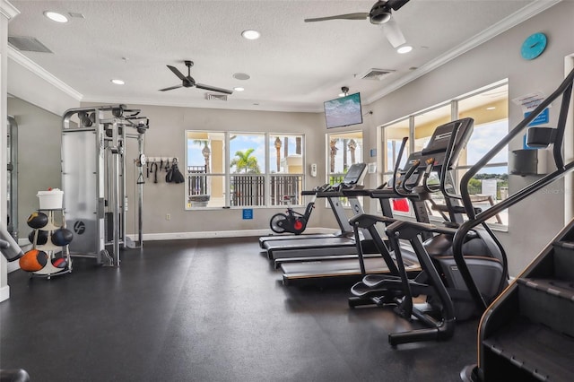 exercise room with a textured ceiling, crown molding, and ceiling fan