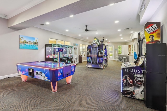 game room with ceiling fan, crown molding, and carpet flooring